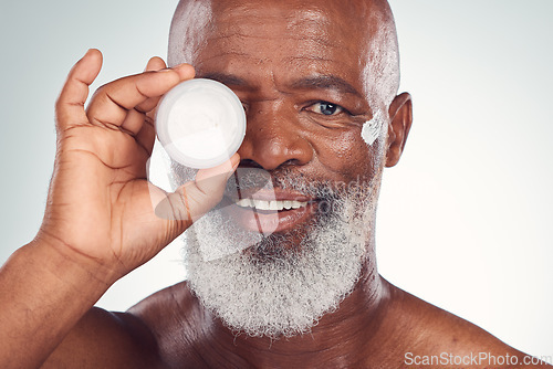 Image of Facial cream, skincare and portrait of black man in studio for wellness, dermatology and healthy skin. Beauty products, advertising and face of senior male with lotion, creme or anti aging treatment