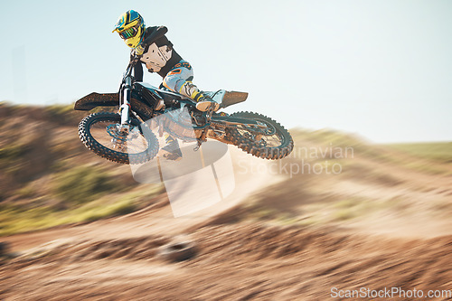 Image of Bike, motorcycle and offroad sports with motion blur, speed challenge and desert. Driver, cycling and air jump on dirt track, competition and motorbike performance on adventure course for fast action