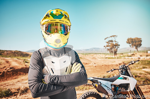 Image of Arms crossed, bike and portrait of a man in nature for adventure, cycling and exercise in Spain. Fitness, sports and athlete with a motorcycle for training, cardio and travel in the mountains