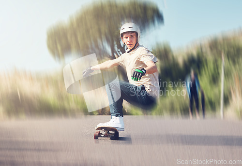 Image of Skate, motion blur and fast with a sports man skating on an asphalt street outdoor for recreation. Skateboard, soft focus and speed with a male athlete or skater training outside on the road