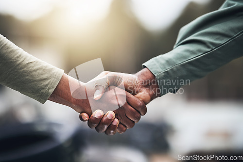 Image of People, hands and handshake for agreement, deal or trust in partnership, unity or support on a blurred background. Hand of team shaking hands for community, teamwork or collaboration in the outdoors