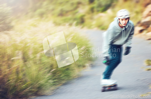 Image of Skateboard, skating sports and man on road for fitness, exercise or wellness. Training, freedom and portrait of male skater moving with fast speed, skateboarding and riding alone outdoors for workout