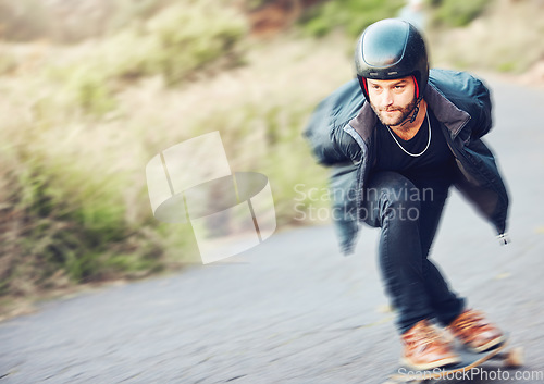 Image of Skateboard, sports and man skating on road for fitness, exercise or wellness. Training, freedom and male skater moving with fast speed, skateboarding and riding alone outdoors for action or workout.