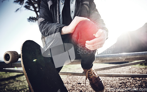 Image of Hands, knee pain and skateboarder man with injury after fall, accident or workout outdoors. Sports, fitness and skater with fibromyalgia, arthritis or leg inflammation, broken bones or painful joint.