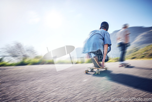 Image of Speed, fast and men skateboarding in the street for adventure, training and exercise in Philippines. Fitness, sport and friends in motion, moving and travel in the road on a skateboard in summer