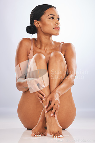 Image of Body, cosmetics and black woman thinking, dermatology and natural beauty on grey studio background. Skincare, African American female and confident lady with healthy, smooth and soft skin on backdrop