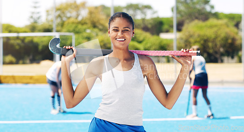 Image of Indian girl, hockey team athlete and portrait of a sport player on outdoor field. Happy person, smile and and sun with a sports female ready for game training, exercise and fitness with happiness