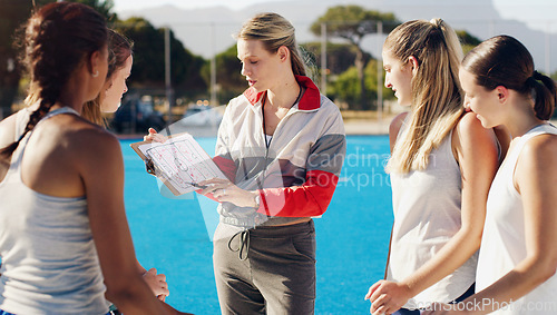 Image of Sports, clipboard and team with coach for planning, game strategy and instructions for female players on court. Fitness, training and woman coaching girls for netball match, practice and competition