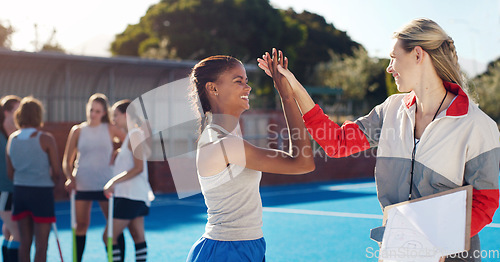 Image of Sports, high five and girl with coach for celebration, motivation and team building for hockey players. Fitness, training and woman coaching girls for match, game practice and competition on court