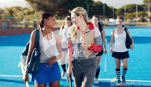 Image of Team leader, hockey and happy discussion with player for coaching, teamwork or collaboration in the outdoors. Fitness sporting coach talking with athlete in friendly conversation for training tips