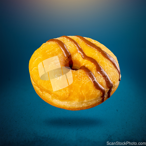 Image of Delicious donut on blue background