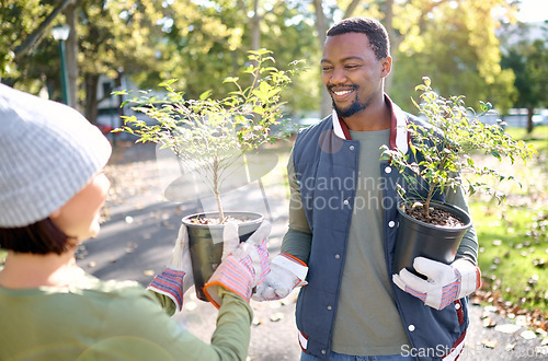 Image of Teamwork, gardening and man with woman in a park happy and smiling for plant growth for sustainability in the environment. Volunteer, black man and people excited for planting as in a garden