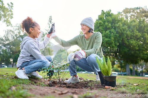 Image of High five, child and woman with plant for gardening, ecology and agriculture in a park with trees. Volunteer family celebrate growth, nature and sustainability for community environment on Earth day