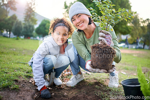 Image of Family portrait, plant and gardening in a park with trees in nature environment, agriculture or garden. Happy volunteer woman and child planting for growth, ecology and sustainability of community