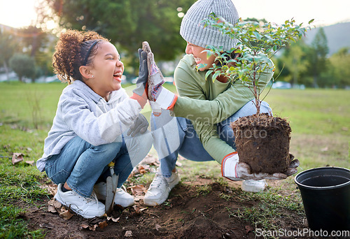 Image of High five, child and woman with plant for gardening at park with trees in nature garden environment. Happy volunteer family planting for growth, ecology and sustainability for community on Earth day