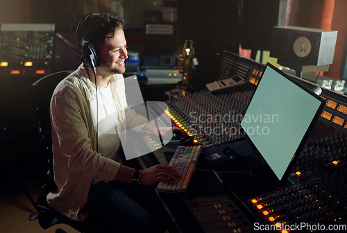 Image of Producer, smile or computer headphones in music recording, sound mixing or song composition in studio. Musician, DJ or happy man on technology and ideas for live streaming radio, audio or media album