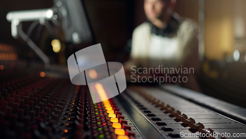 Image of Music mixer, sound board and producer in radio industry, broadcast and scales in studio. DJ equipment, electronic media and audio engineering machine for recording, song production and control room