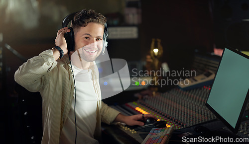 Image of Portrait, smile or musician on recording headphones in sound engineering, edm song composition or production studio. DJ, happy man or producer technology in live streaming radio, audio or media album