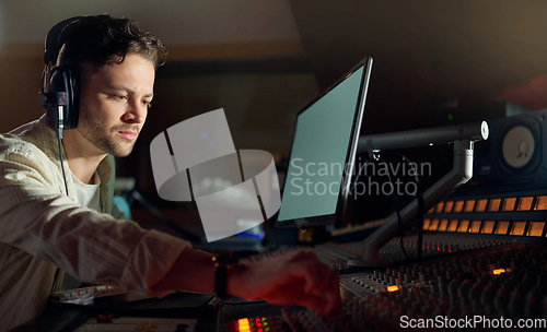 Image of Musician, thinking or computer headphones for music recording, sound mixing or song composition in studio. Producer, DJ or man on technology with ideas for live streaming radio, audio or media album