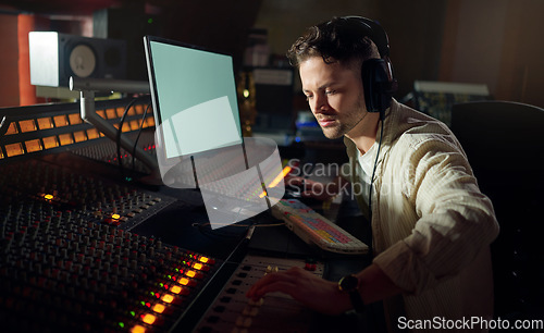 Image of Man, thinking or recording headphones for music, sound mixing or computer song composition in studio. Musician, DJ or producer on technology with ideas for live streaming radio, audio or media album