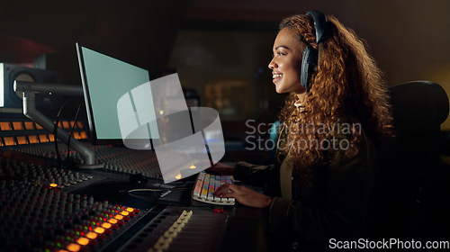 Image of Woman, smile or recording headphones in music, sound mixing or computer song composition in studio. Producer, DJ or happy musician on technology ideas for live streaming radio, audio or media album