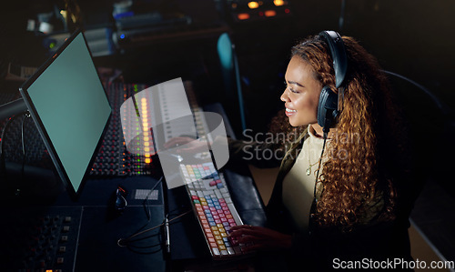 Image of Woman, smile or musician headphones in computer music recording, sound engineering or song composition in studio. Producer, happy or DJ on technology in live streaming radio, edm audio or media album