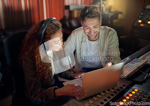 Image of Collaboration, teamwork or music recording with sound headphones, laptop or composition app in edm studio. Musician, friends or happy people on technology in night radio, audio or dj media production