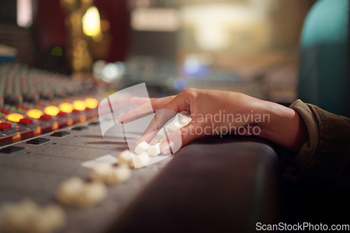 Image of Hands, music mixer and sound board of radio producer, broadcast and scales in studio. DJ equipment, electronic media and switch of audio engineering machine for recording, production and control room