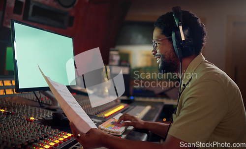 Image of Man, happy or music sheets in recording, sound engineering or song composition studio. Producer, singer or smile musician with headphones on technology mockup for radio, audio or media album mixing