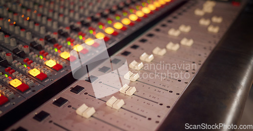 Image of Electronic board, mixer and audio deck for radio production, broadcast or scales in studio. Background of equipment, sound media and switch of music engineering for recording, machine or control room