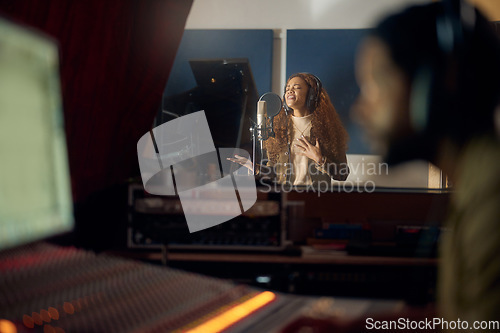 Image of Woman, singing or studio recording microphone for album, audio or radio music cover in night production. Singer, artist or musician with producer in evening song, media or sound performance practice