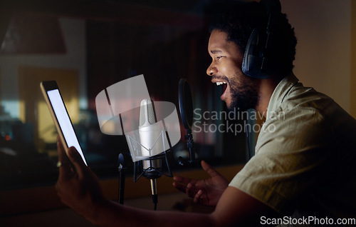 Image of Tablet, singing or black man on studio microphone, mockup music or mock up lyrics in dark recording. Singer, musician or artist on technology production app, voice media or sound performance practice