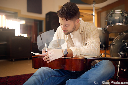 Image of Idea, artist and musician writing a song for a performance, sound and talent in the studio. Creative, planning and artist with a guitar for music production, rehearsal and guitarist with a hobby