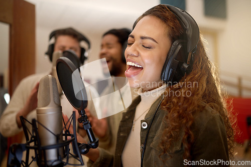 Image of Woman, face or singing on studio microphone with backup singers in album, song or radio recording. Artist, musician or friends and production headphones in sound, voice or media performance for label