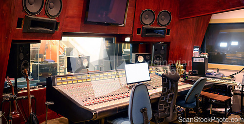 Image of Music, studio and technology with recording equipment in an empty room for the entertainment industry. Interior, creative and audio with musical electronics to produce, record or control sound