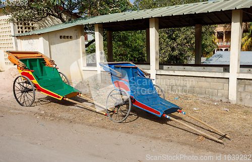 Image of Pulled rickshaw in street of north madagascar.