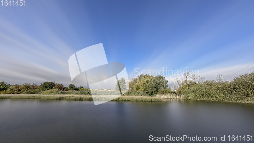 Image of Long Exposure Autumn Colors Reflected Pond