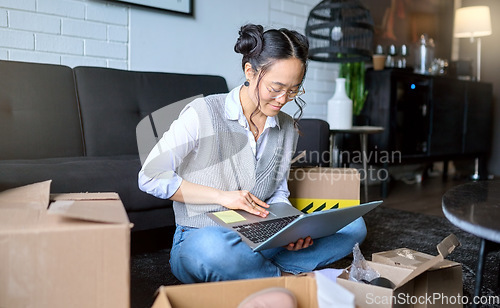 Image of Planning, real estate and woman with a laptop while moving for apartment email and online contract. Mortgage, boxes and Asian girl typing on a computer for a relocation property idea in the lounge