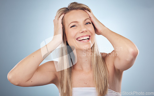 Image of Portrait, beauty and haircare with a model woman in studio on a gray background for keratin treatment. Face, skincare and hair with an attractive young female posing to promote natural cosmetics