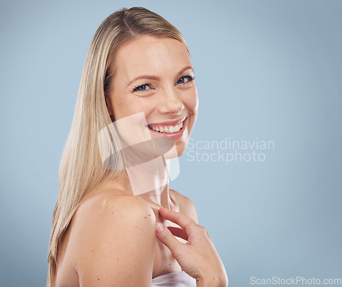 Image of Portrait, beauty and mockup with a model woman in studio on a gray background for skincare treatment. Face, skin and mock up with an attractive young female posing to promote natural cosmetics