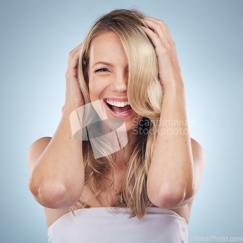 Image of Face portrait, hair care and beauty of woman in studio isolated on a gray background. Keratin, cosmetics and laughing female model with blonde hairstyle after salon treatment for growth or texture.