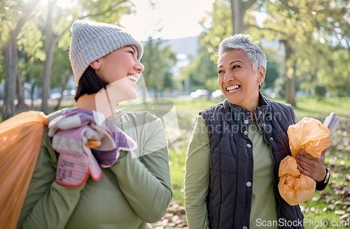 Image of Cleaning, plastic bag and people in park for community service, volunteering and pollution help, support and goals. Happy senior woman with youth in nature or forest with waste, garbage or recycling