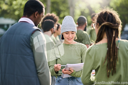 Image of Volunteering, team and people in nature for community service, support and planning of leadership goals. Ngo, charity person with schedule or task management in forest, park or eco friendly project