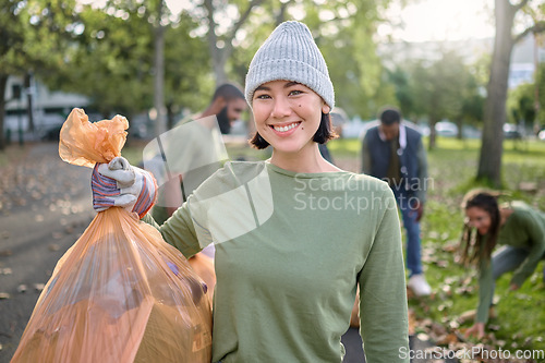 Image of Park, plastic bag and woman in cleaning portrait for eco friendly environment, community service or volunteering. Recycle, trash or waste goals of happy ngo person in nature, forest pollution support