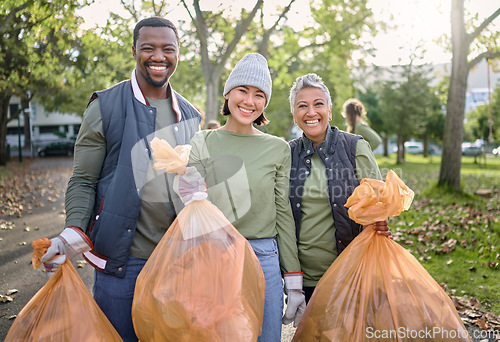 Image of Volunteer men and women cleaning park as community service with plastic in garbage bag. Diversity group help with trash for eco friendly lifestyle and bottle recycling for pollution outdoor in nature