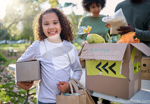 Image of Food, donation and portrait of child in park with smile and grocery box, healthy diet at refugee feeding project. Girl, charity and donations help feed children and support from farm volunteer at ngo