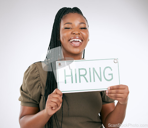 Image of Creative business woman, hiring sign and advertisement for recruiting isolated on gray studio background. Portrait of happy African American female manager with board for recruitment, hire or startup