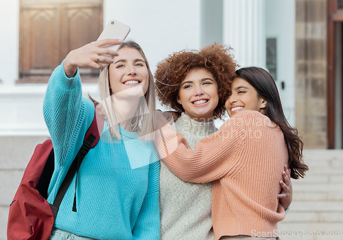 Image of Women students, selfie and smile with hug at college campus for goals, diversity and social network. Gen z woman, group and smartphone with embrace, happiness and studying at university for success