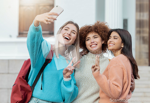 Image of Women group, peace selfie and students with hug at college campus for goals, diversity or social media. Gen z woman, happy photo and smartphone for embrace, smile and study at university for success