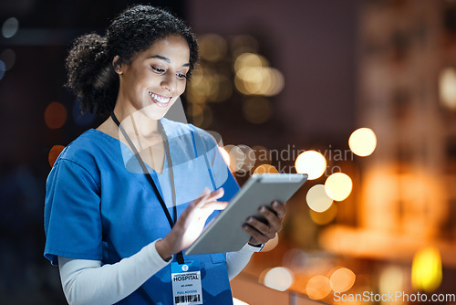 Image of Medical, research and night with doctor and tablet for planning, medicine and schedule. Technology, review and digital with black woman reading report for healthcare, science and life insurance news